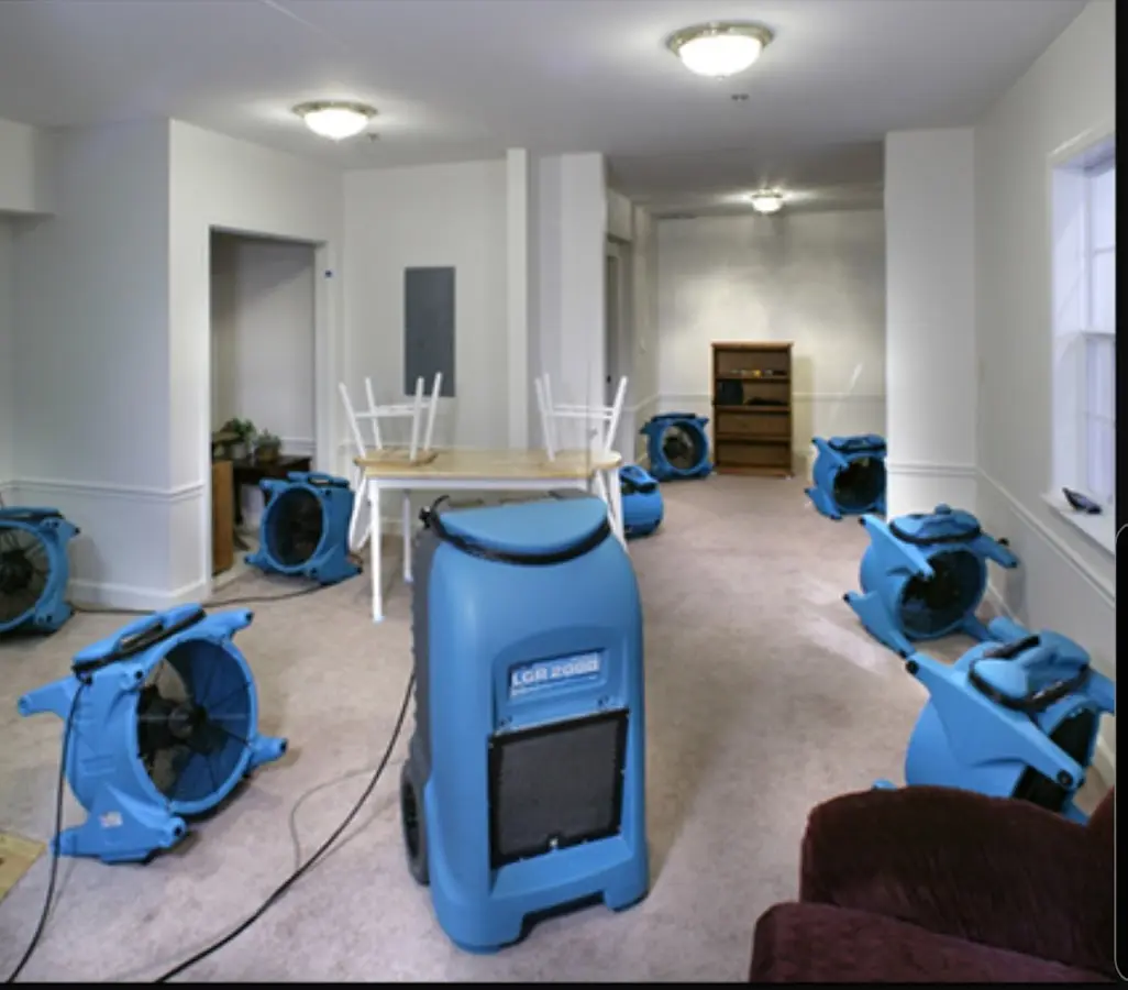 Air movers and dehumidifier setup for Water Damage Restoration in East Troy